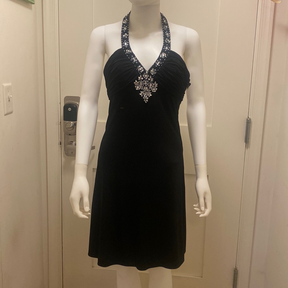 Women NIGHT WAY black dress with details in the collar, chest n back. Like new